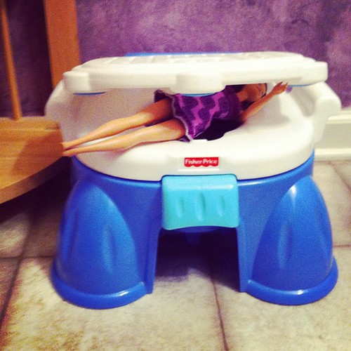 Lucy apparently wants to potty train her friends. (Poor Barbie.)