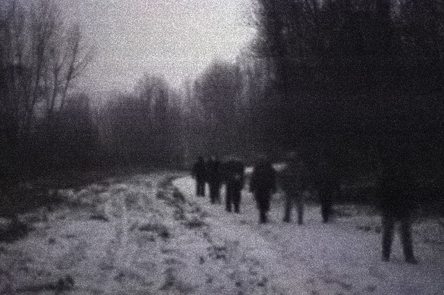 Columbia Bottom Conservation Area, in Saint Louis County, Missouri, USA - hikers in forest at night in the snow and fog 1