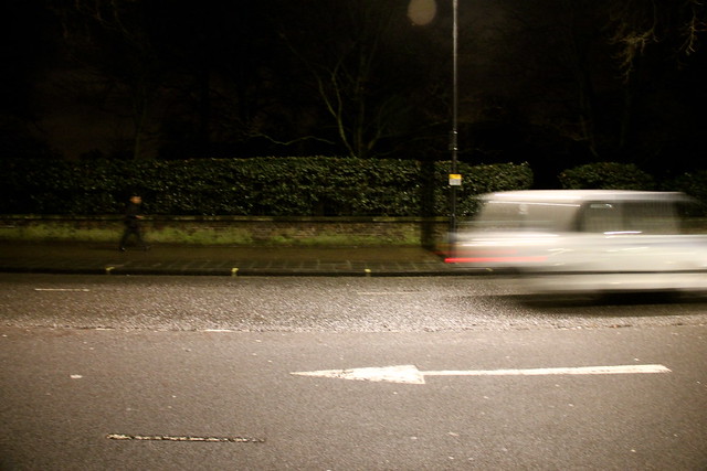 Car Speeds Past hyde Park, London