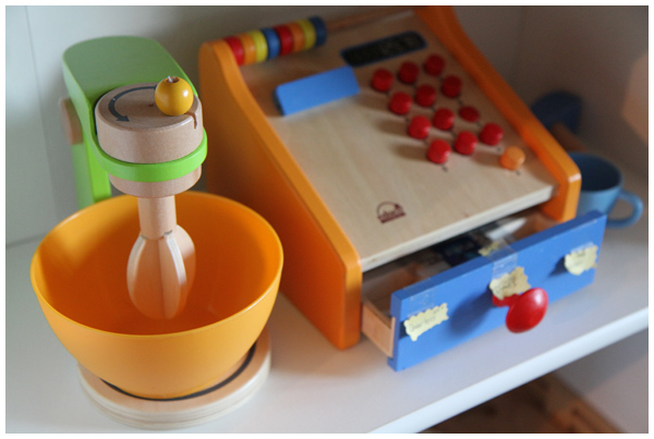 Unpacking the Kitchen(s) - play kitchen and wooden cash register