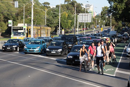 Queue of cyclists waiting at the traffic lights