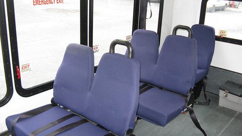 Right side interior seats folded down aboard a Ford paratransit mini bus. by Eddie from Chicago