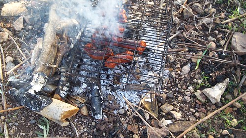sobrasada cooking on olive wood fire