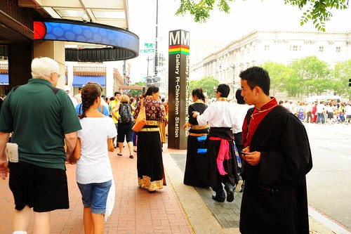 Tibetan people at Kalachakra on the streets of Washington D.C. wearing formal chubas, tourists, Seventh street NW, Chinatown, USA by Wonderlane