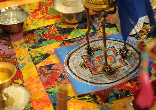 Ritual objects - Silk supporting vajra feet on a painted mandala, nectar and rice, for an initiation: Spontaneously Occurring Heart Essence of Padma, Rangjung Padma'i Nyingthig, given by Khyentse Yangsi Rinpoche, Lotus Speech, Vancouver BC, Canada by Wonderlane