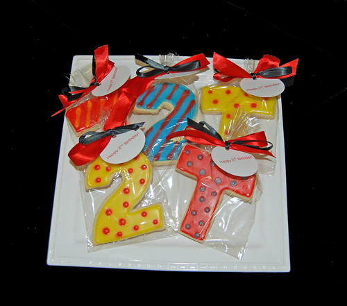 Bright colored monogram and number cookie favors for a 2nd birthday