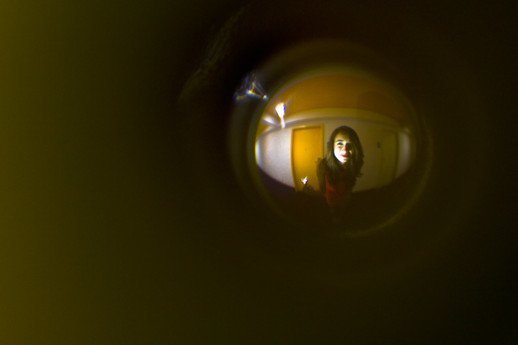 Rachel through the peep hole at the door