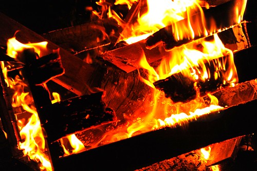Wooden crate with the fire of its own burning, on fire, night, Seattle, Washington, USA by Wonderlane