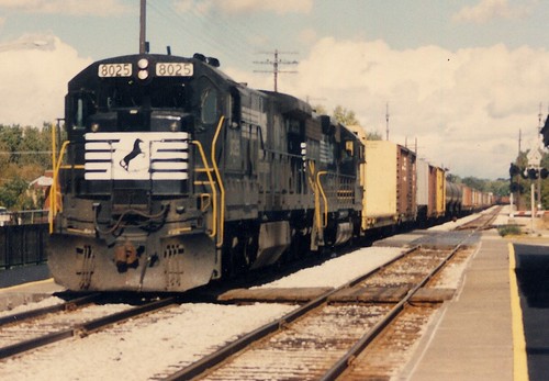 Westbound Norfolk Southern freight train passing through the Metra Chicago Ridge commuter rail station.  Chicago Ridge Illinois.  October 1989. by Eddie from Chicago