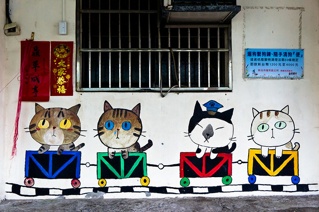 Mural of cats in mining cars