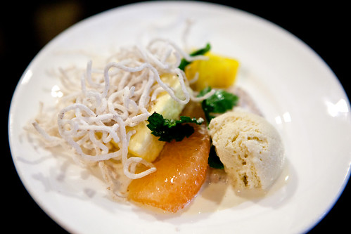 Yuzu Chiboust with coconut rice pudding, caraway ice cream, grapefruit segment, diced pineapple, fried spiced rice noodles