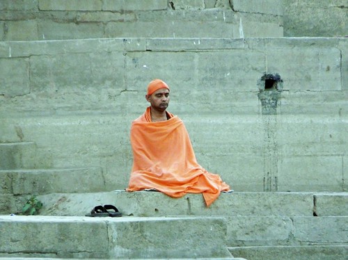 Man praying at one of the ghats of Benares (Varanasi, India)