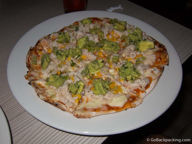 BBQ chicken pizza with cheese, avocado and corn