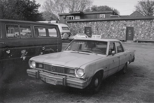 An old worn out early 1970's era Chrysler taxi cab.  Lyons Illinois.  May 1989. by Eddie from Chicago