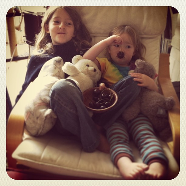 A bowl of cherries, favourite movie and a sister to snuggle #lovethem #sisters