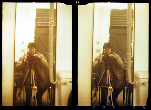 reflected self-portrait with Stereo Puck camera and borrowed hat by pho-Tony