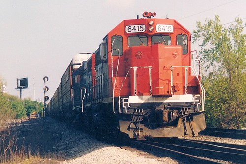 Northbound Grand Trunk Western Railroad auto rack train approaching Mc Cook Junction.  Mc Cook Illinois.  May 1989. by Eddie from Chicago