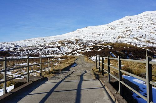 Crossing the bridge and heading down the main track below Lochan na Lairige Reservoir, Meall nan Tarmachan