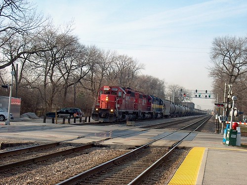 Eastbound Canadian Pacific freight train approaching the North Oak Park Avenue railroad crossing.  December 2006. by Eddie from Chicago