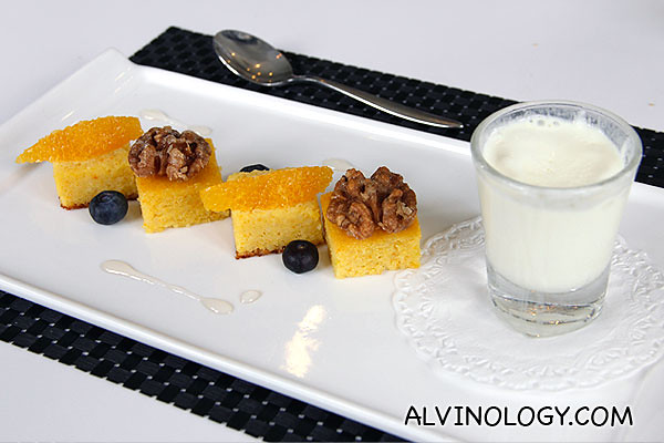 Orange flourless cake served with citrus segments and sweet walnuts