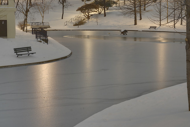 Clifton Heights Park, in Saint Louis, Missouri, USA - lake at night with snow