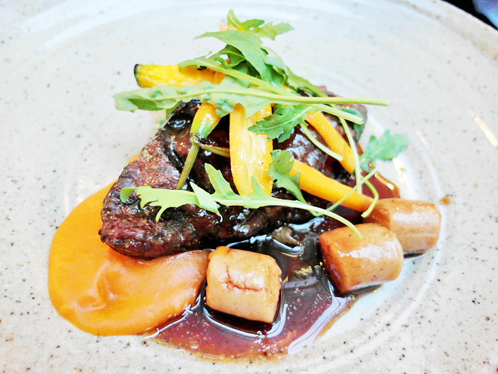 48 hour braised beef cheek with mochi potatoes, carrot puree & pea tendrils