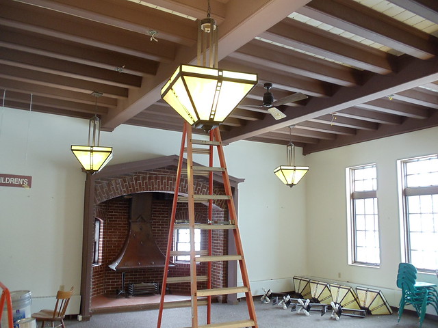 Some pendant lights from reading room are being moved by entryway