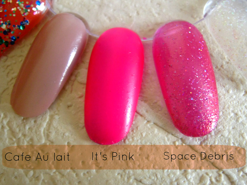 A picture of W7 nail polishes in Cafe Au lait, Space Debris and It's Pink. 