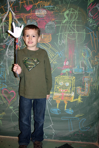 Chalkboard_Nathan-standing-by-it