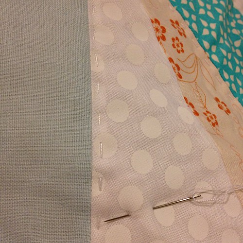 This white on white fabric is NOT fun to Hand quilt.   :( the "white" is like paint.   Eww.