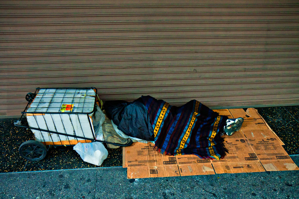 Sleeping-woman-with-folding-shopping-cart-on-3-27--Los-Angeles
