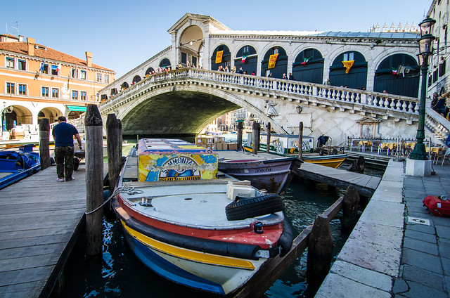 Beneath the Rialto bridge, a boat transporting gelato through the canals of Venice.