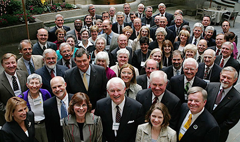 A crowd of mostly male college presidents