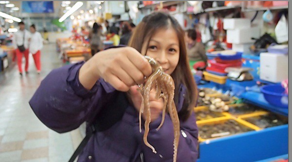 Rebecca saw eating live octopus in Korea1