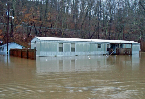 March 13, 2010 -- A trailer home badly flooded as a result of Dunloup Creek flooding. NRCS photo by Mark Bushman.