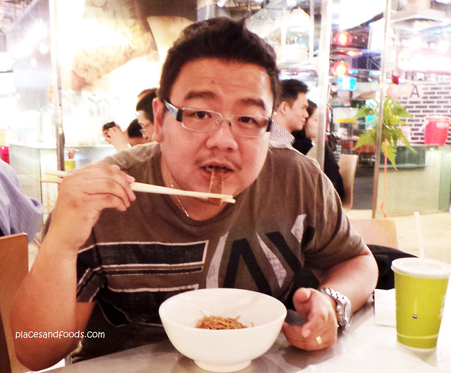 Tai Lei Loi Kei eating noodle