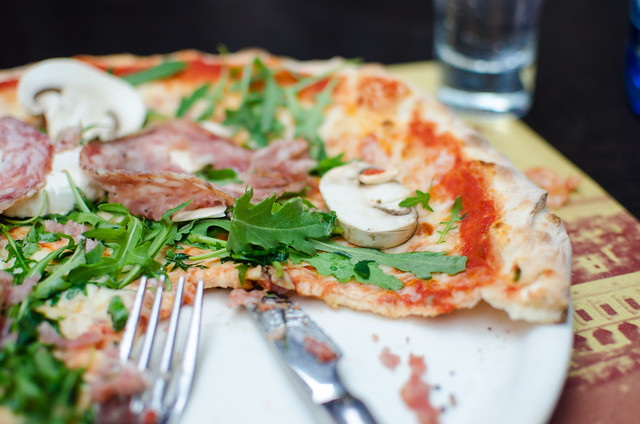 Use a knife and fork to dig into pizza in Venice.
