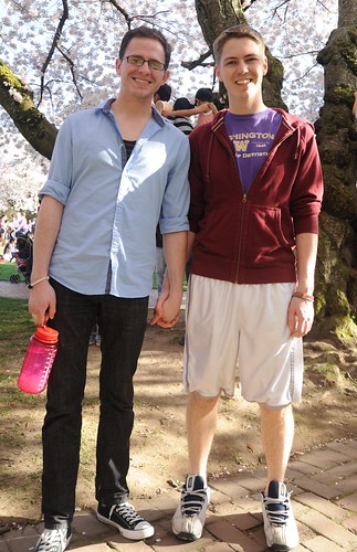 Holding hands, a sign of love in the spring, under the full cherry tree blossoms, University of Washington, Seattle, Washington, USA by Wonderlane