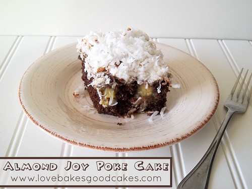 Almond Joy Poke Cake piece on plate with fork. 
