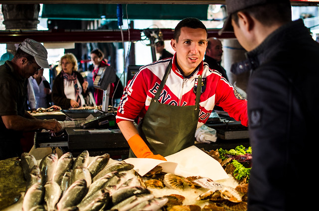 A fish monger at the Rialto Market in Venice, Italy
