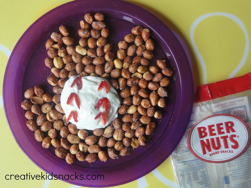 Fun Baseball Snack by CreativeKidSnacks.com.  Made from yogurt, strawberries, and peanuts.  Add more fresh strawberries and yogurt and serve in individual cups for a little fruit/yogurt/nut parfait!