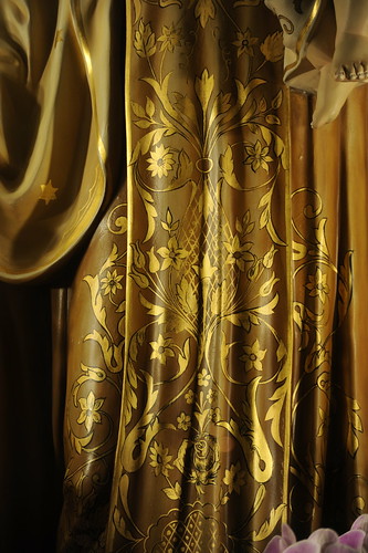 Gold decoration on Mary's gown, statue, baby Jesus' feet, Our Lady of Peace, Santa Clara, California, USA by Wonderlane
