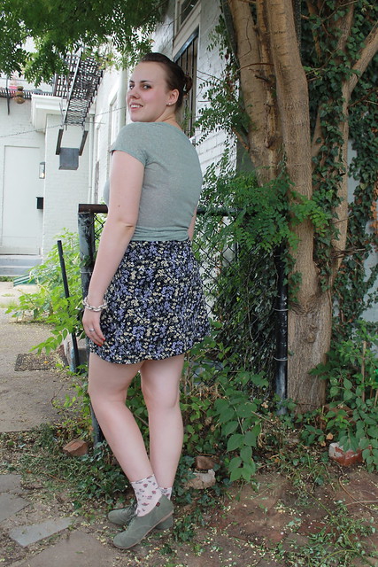 Sage outfit: green t-shirt, vintage '90s mini skirt, rosette socks, canvass lace-ups, etc.