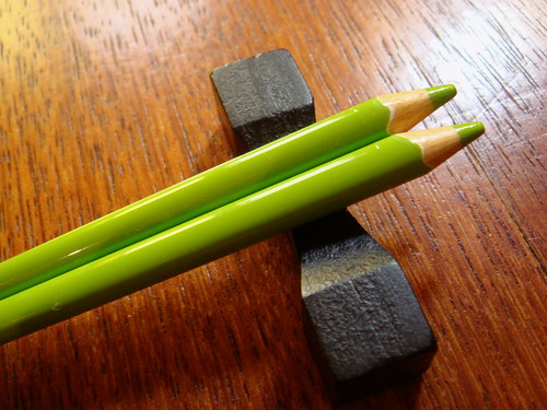 Chopsticks. Green crayons.