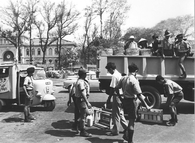 VN Boy Scouts along with other youth groups and civilian volunteers load supplies furnished by the government for distribution