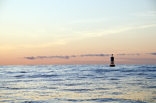 Ocean Buoy at sunrise by Alida's Photos