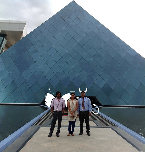 Angels all (with a little devilish you see) the famed AAA Design Team, Ananda, Aparna, Amit, standing on the bridge over the moat to the pyramid (from Greek: πυραμίς pyramis) building, Infosys, Bangalore, India by Wonderlane