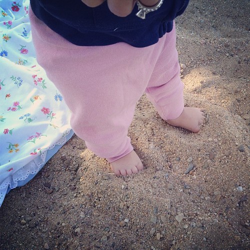First time sticking her toes in the sand.
