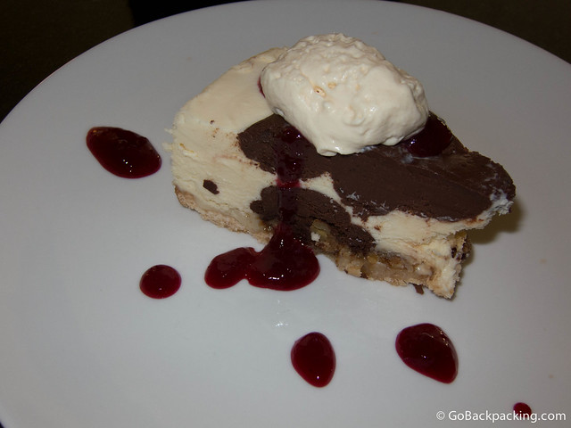 Chocolate pie with vanilla ice cream and raspberry sauce