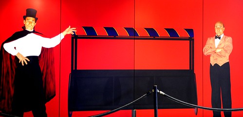 Emptiness: The Magic Trick, magician & assistant, top hat and cape, painted panels, magic box, red, black, blue, white, painting, Seatac Airport, Seattle, Washington, USA